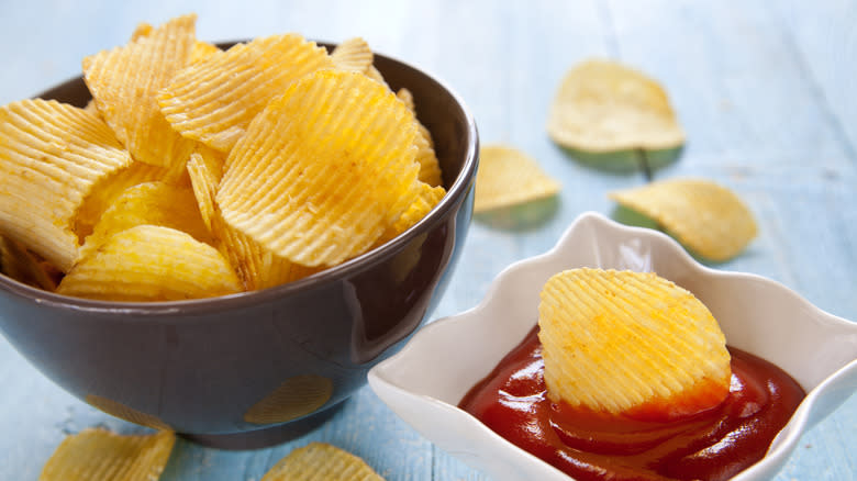 potato chip dunked in ketchup