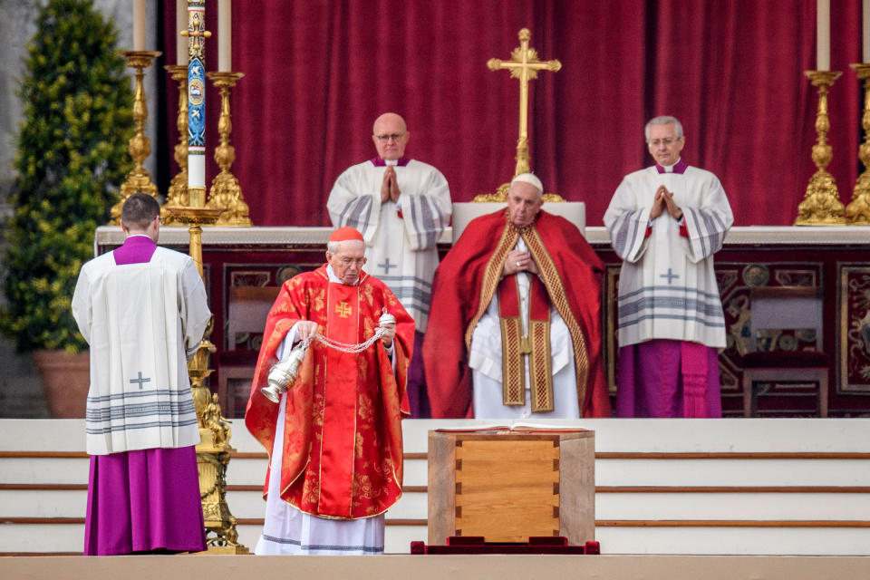 Cardinal Giovanni Battista Re swings a thurible of incense on the coffin of Pope Emeritus Benedict XVI during the funeral mass at St. Peter's square on Jan. 5, 2023 in Vatican City.<span class="copyright">Antonio Masiello—Getty Images</span>