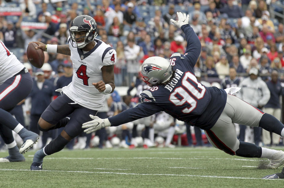 New England Patriots defensive tackle Malcom Brown (90) pursues Houston Texans quarterback Deshaun Watson (4) during the second half of an NFL football game, Sunday, Sept. 9, 2018, in Foxborough, Mass. (AP Photo/Stew Milne)