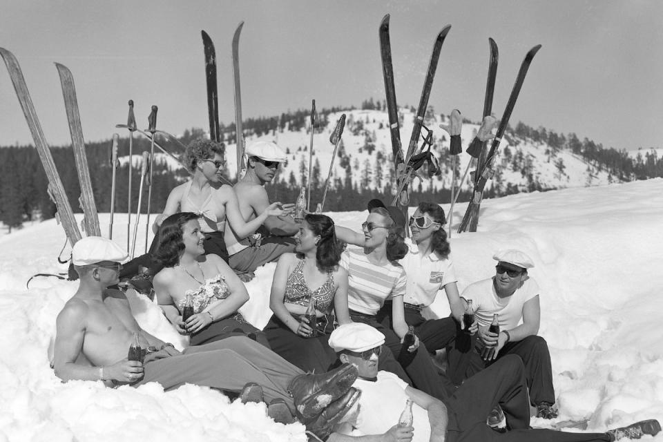 Skiers relax on a warm spring day. Photo taken on 4/21/1949 in Soda Springs, CA near Donner Summit.<p>Credit: Bettmann/Getty Images</p>