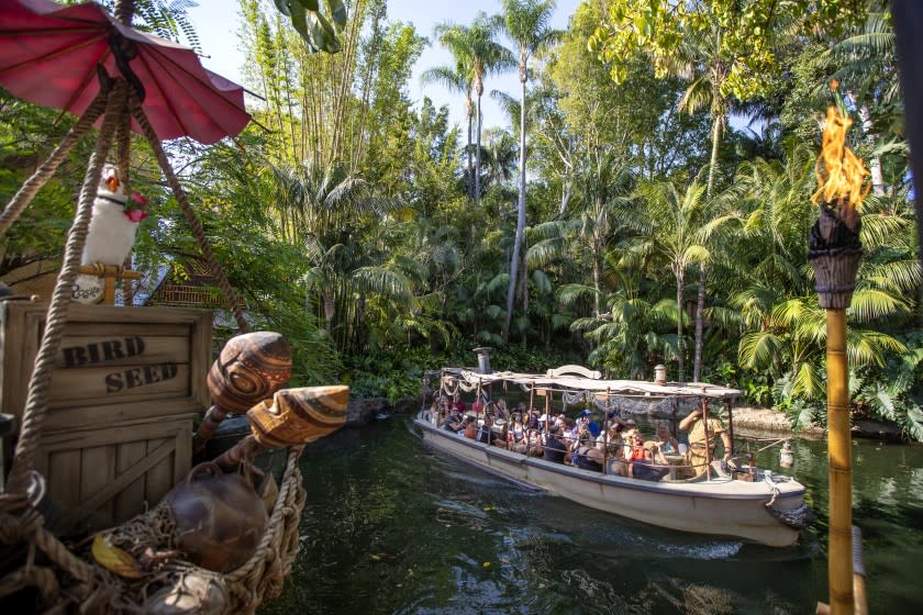 Anaheim, CA - July 09: Passengers ride the Jungle Cruise ride at Adventureland, Disneyland in Anaheim, CA, on Friday, July 9, 2021. The official reopening of Jungle Cruise will be on July 16, 2021, with new adventures, an expanded storyline and more humor as skippers take guests on a tongue-in-cheek journey along some of the most remote rivers around the world at Disneyland. What's new: The expanded backstory centers around Alberta Falls, the granddaughter of the world-renowned Dr. Albert Falls, who is now proprietor of the Jungle Navigation Company Ltd. New scenes include: A safari of explorers from around the world finds itself up a tree after the journey goes awry. Chimpanzees have taken over the expedition's wrecked boat. A Lost & Found location has turned into a Gift Shop run by Alberta's longtime friend, Trader Sam. (Allen J. Schaben / Los Angeles Times)