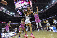 South Carolina's Mikiah Herbert Harrigan (21) passes while defended by LSU's Jaelyn Richard-Harris (13) and Mercedes Brooks during the first half of an NCAA college basketball game Thursday, Feb. 20, 2020, in Columbia, S.C. (AP Photo/Richard Shiro)