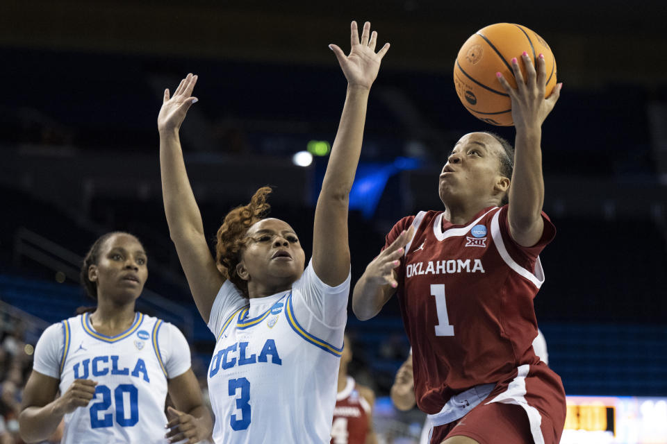 Oklahoma guard Nevaeh Tot (1) shoots over UCLA guard Londynn Jones (3) during the first half of a second-round college basketball game in the NCAA Tournament, Monday, March 20, 2023, in Los Angeles. (AP Photo/Kyusung Gong)