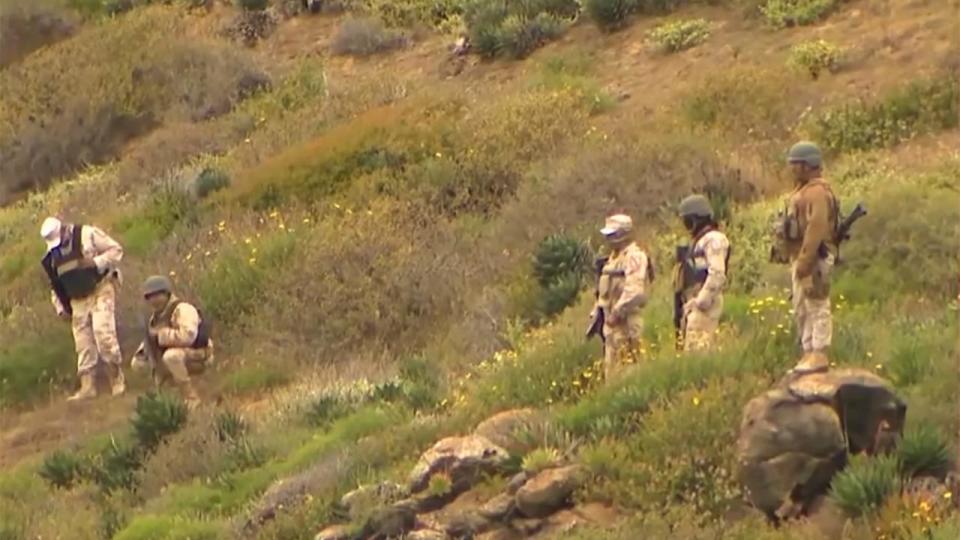 Mexican security forces at a crime scene where bodies were found.