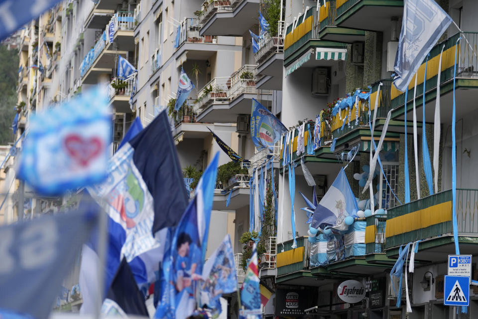 A view of a street adorned with Napoli soccer team flags in Naples, Italy, Thursday, May 4, 2023. (AP Photo/Andrew Medichini)