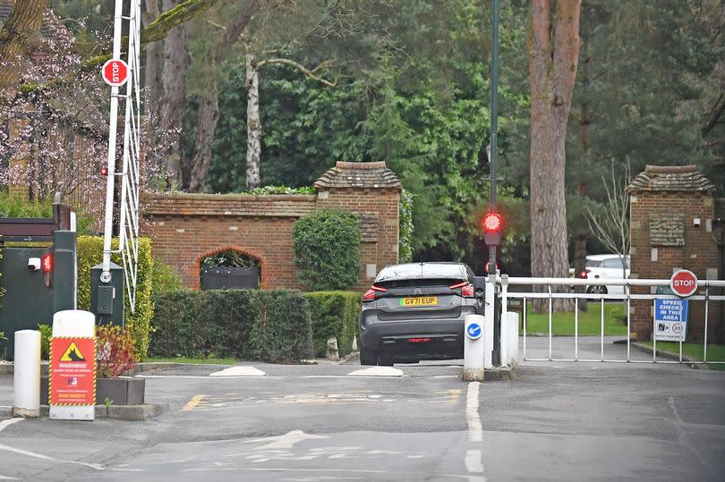 A car passes through the automatic barriers used to keep out unwanted visitors at St George's Hill, Weybridge