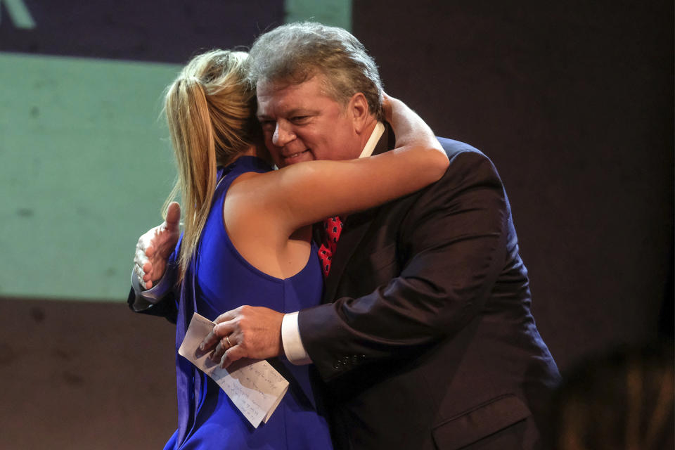 Gubernatorial candidate, Democratic Attorney General Jim Hood gets a congratulatory hug from his daughter Annabelle after winning the party primary, Tuesday, Aug. 6, 2019, at Duling Hall in Jackson, Miss. (AP Photo/Charles A. Smith)