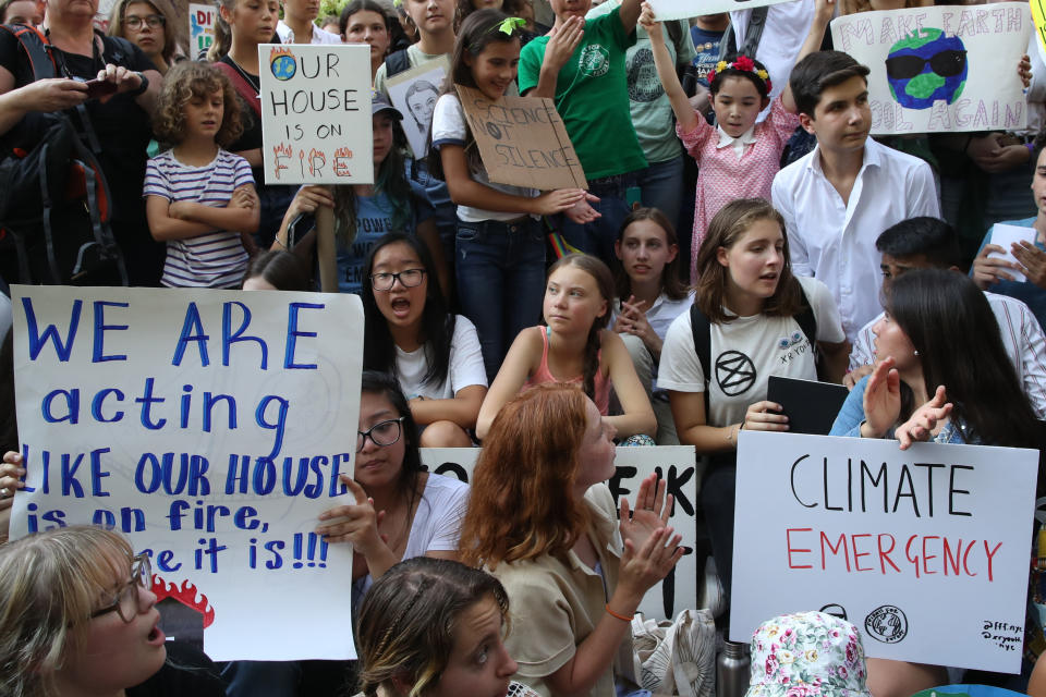 Swedish environmental activist Greta Thunberg, center, participates in a Youth Climate Strike outside the United Nations, Friday, Aug. 30, 2019 in New York. Thunberg is scheduled to address the United Nations Climate Action Summit on September 23. (AP Photo/Mary Altaffer)