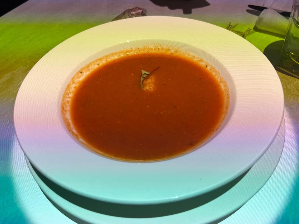 White bowl of tomato soup at Le Petit Chef