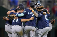 Seattle Mariners celebrate the team's 6-2 win in a baseball game against the Texas Rangers in Arlington, Texas, Friday, Aug. 12, 2022. (AP Photo/Tony Gutierrez)