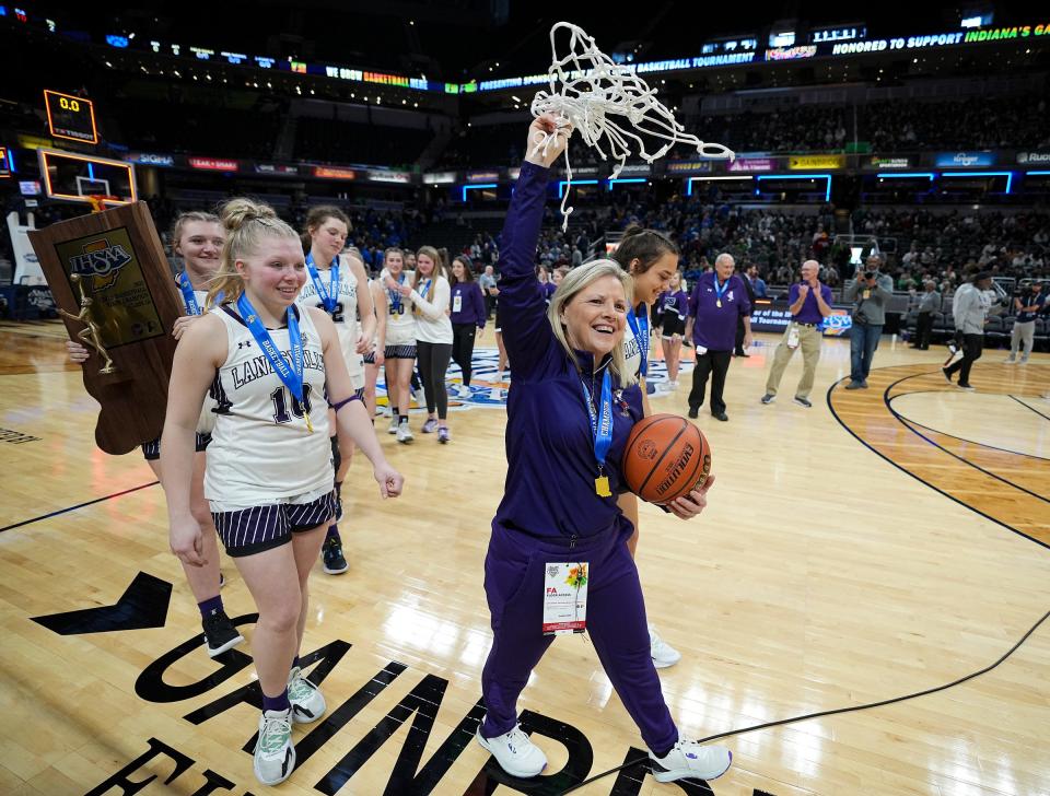 Lanesville Eagles head coach Angie Hinton celebrates with her team after winning the IHSAA Class A championship Saturday, Feb. 25, 2023, at Gainbridge Fieldhouse in Indianapolis. Lanesville defeated Bethany Christian, 60-41, for the title.