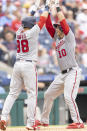 Washington Nationals' Yan Gomes (10) celebrates with Gerardo Parra (88) after hitting a two-run home run during the seventh inning of a baseball game against the Philadelphia Phillies, Thursday, July 29, 2021, in Philadelphia in the first game of a double header. (AP Photo/Laurence Kesterson)