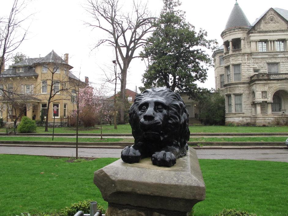 This April 3, 2014 photo shows a lion statute featured in a section of the Old Louisville neighborhood known for its stately Victorian homes. Old Louisville has undergone a revitalization that makes it a showcase in Kentucky’s largest city. (AP Photo/Bruce Schreiner)