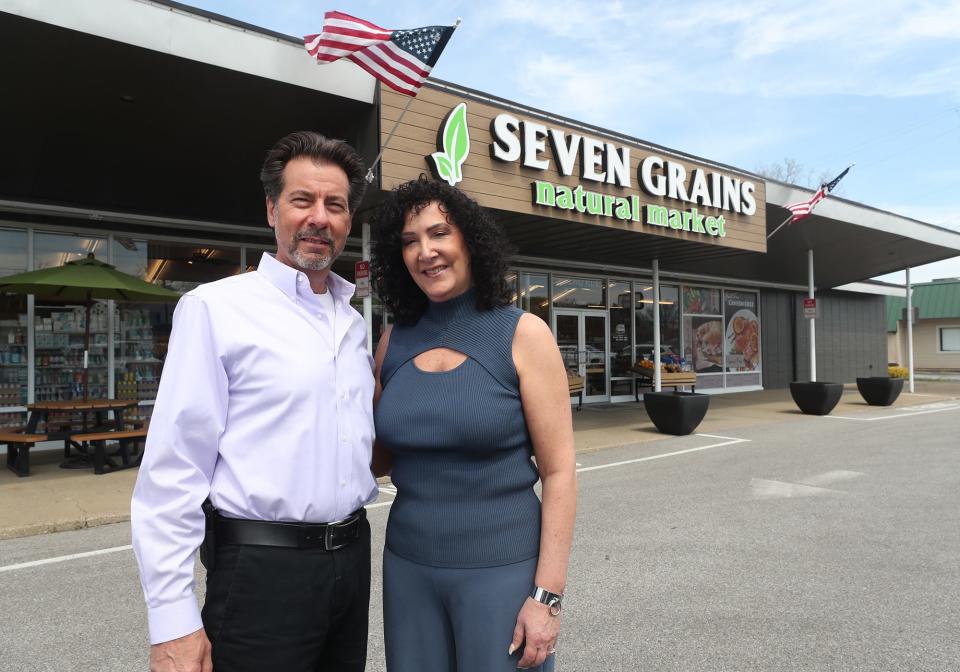 David and Gina Krieger, owners of Seven Grains Natural Market, stand outside of their Tallmadge market.
