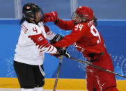 Ice Hockey - Pyeongchang 2018 Winter Olympics - Women's Semifinal Match - Canada v Olympic Athletes from Russia - Gangneung Hockey Centre, Gangneung, South Korea - February 19, 2018 - Brigette Lacquette of Canada (L) and Yevgenia Dyupina, an Olympic Athlete from Russia, in action. REUTERS/Grigory Dukor