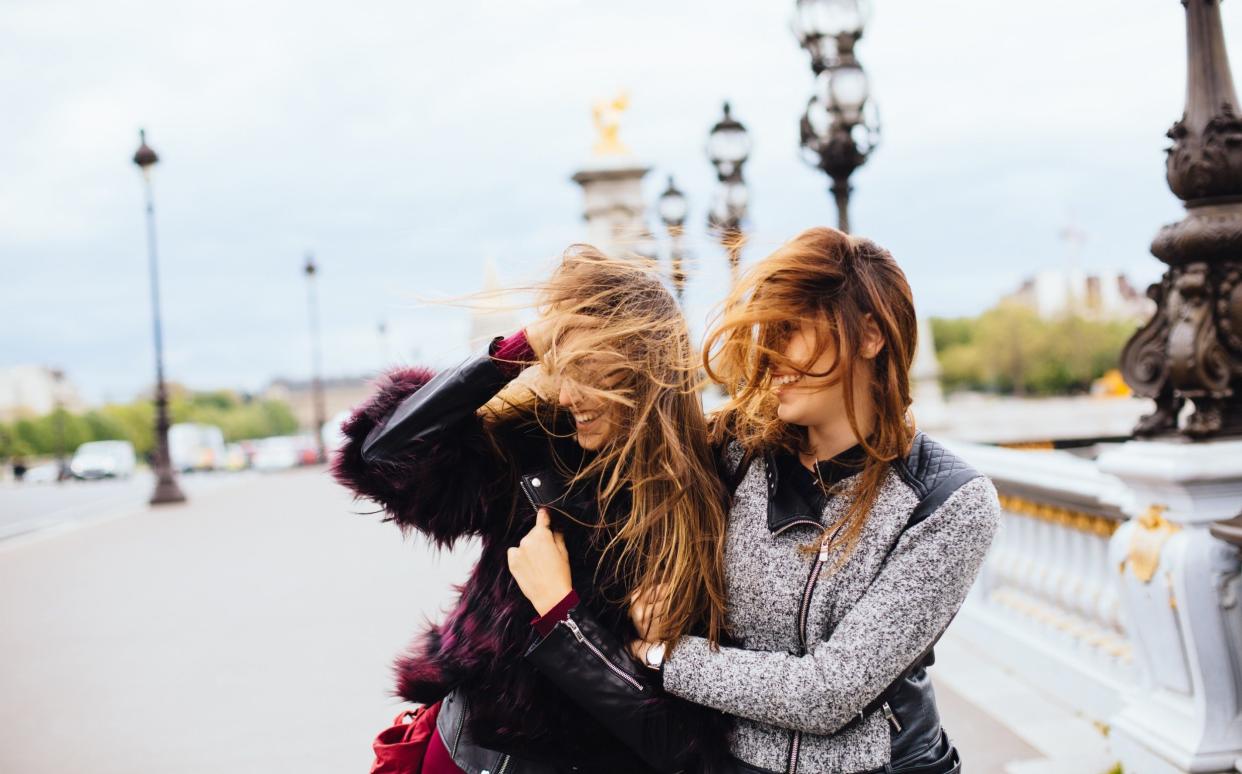 Women walk in Paris