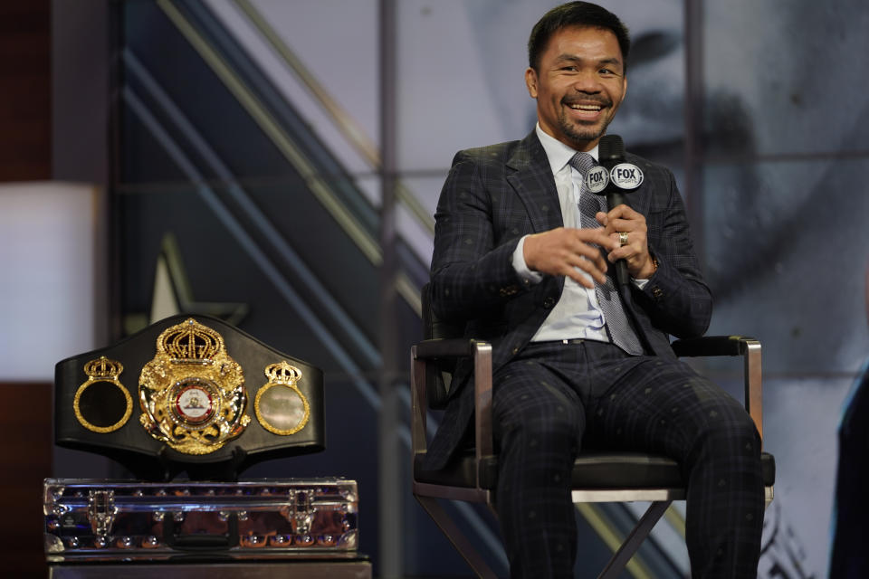 Boxer Manny Pacquiao smiles during a news conference with Errol Spence Jr., Sunday, July 11, 2021, at the Fox Studios lot in Los Angeles ahead of their upcoming boxing match, taking place in Las Vegas on Aug. 21. (AP Photo/Damian Dovarganes)