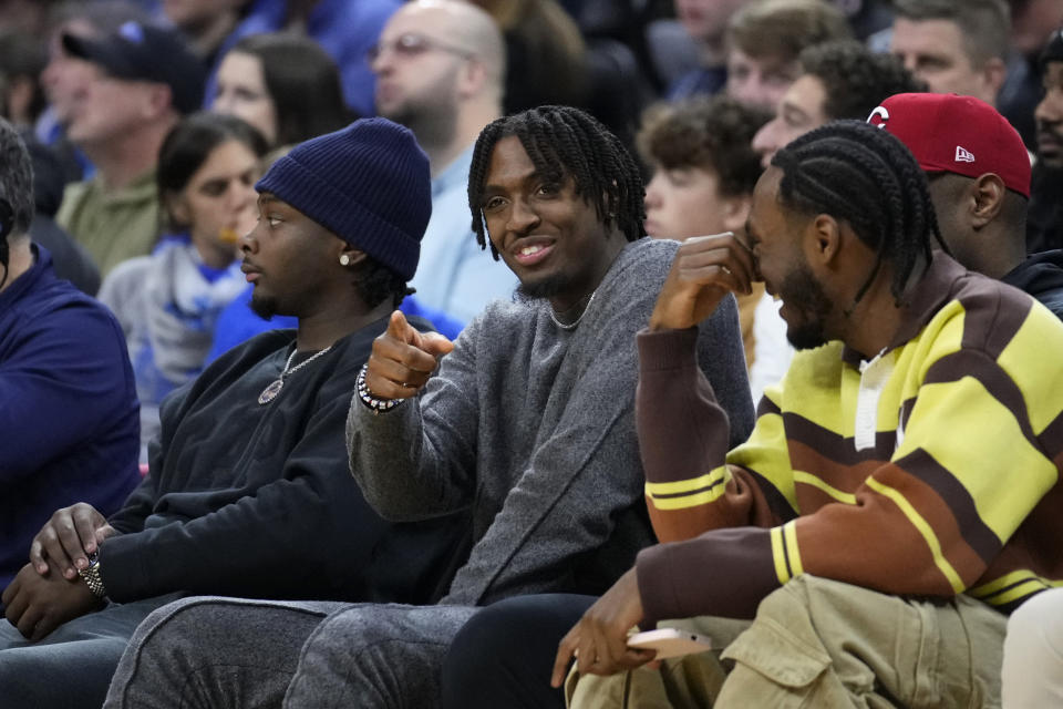 Philadelphia 76ers' Tyrese Maxey watches an NCAA college basketball game between Pennsylvania and Kentucky, Saturday, Dec. 9, 2023, in Philadelphia. (AP Photo/Matt Slocum)