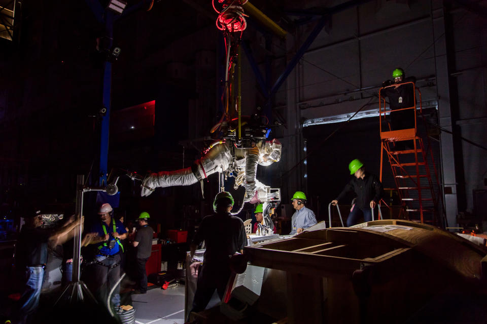 <p>Using a system similar to an overhead bridge crane, Canadian Space Agency astronaut Jeremy Hansen is suspended over a mock-up of the International Space Station during a microgravity simulation in the Active Response Gravity Offload System (ARGOS) at NASA’s Johnson Space Center on Oct 24, 2017. (Photo: NASA/Josh Valcarcel) </p>