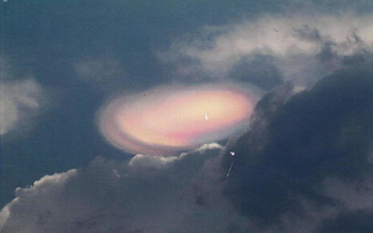 Photo circa March 2004 of doughnut-shaped phenomenon was photographed by a retired RAF officer and sent to his old bosses tasked with investigating UFOs. - PA