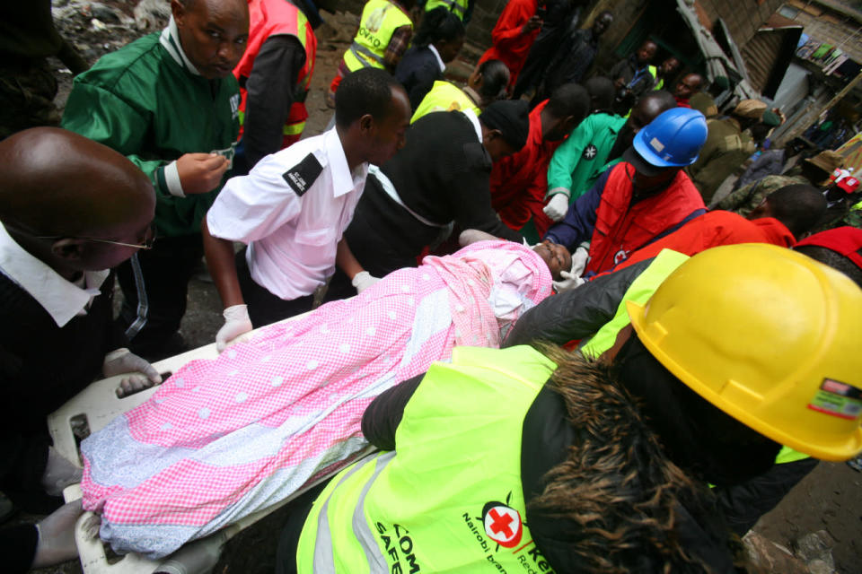 <p>Paramedics evacuate a man rescued from the rubble of a six-story building that collapsed after days of heavy rain, in Nairobi, Kenya, April 30, 2016. <i>(Photo: Gregory Olando/Reuters)</i></p>