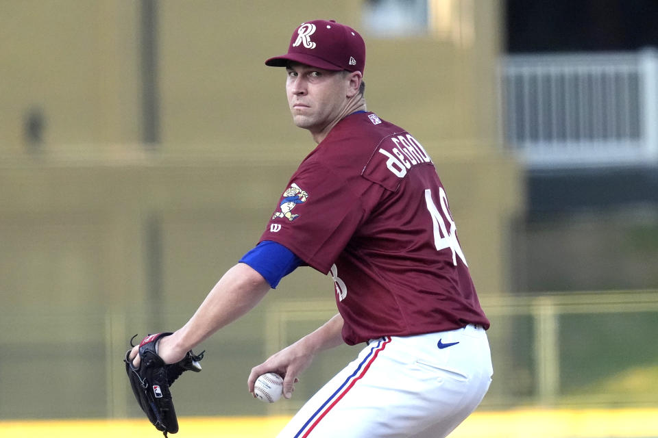 Texas Rangers pitcher Jacob deGrom winds up to throw during his rehab start in a Frisco Rough Riders baseball game in Frisco, Texas, Thursday, Aug. 22, 2024, (AP Photo/LM Otero)