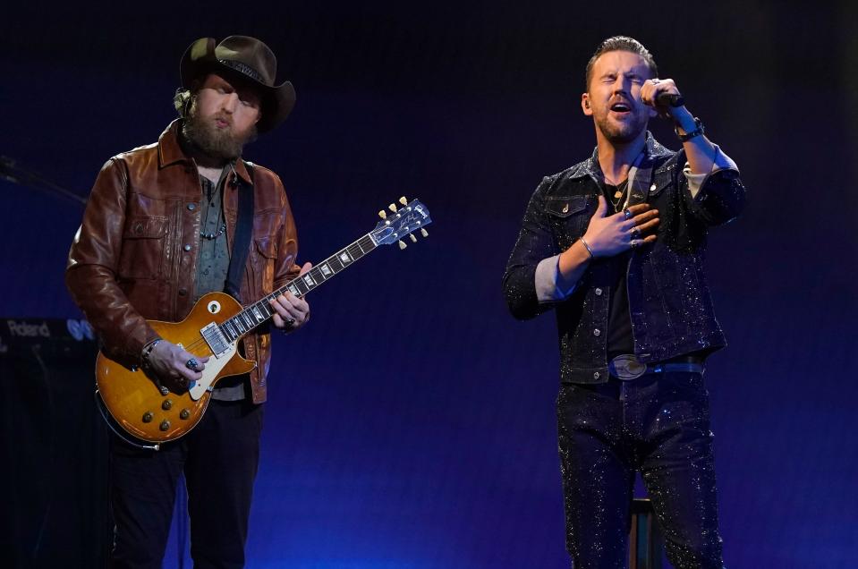 John Osborne, left, and T.J. Osborne, of Brothers Osborne, perform at the 55th annual CMA Awards on Nov. 10, 2021, at the Bridgestone Arena in Nashville, Tenn. The duo will be performing at the White House on July 4th.