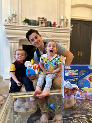 <p>Little tikes</p> David Henrie and his two kids with MGA Entertainment's Story Dream Machine