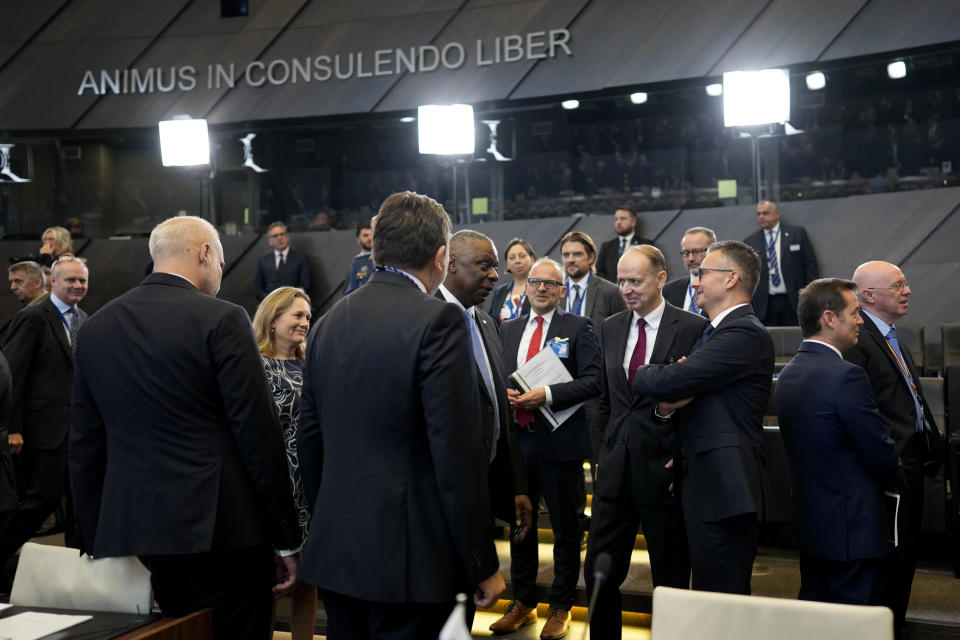 United States Secretary of Defense Lloyd Austin, center, speaks with Slovenia's Defense Minister Marjan Sarec, fourth right, during a meeting of the North Atlantic Council in defense ministers format at NATO headquarters in Brussels, Thursday, Oct. 12, 2023. (AP Photo/Virginia Mayo)