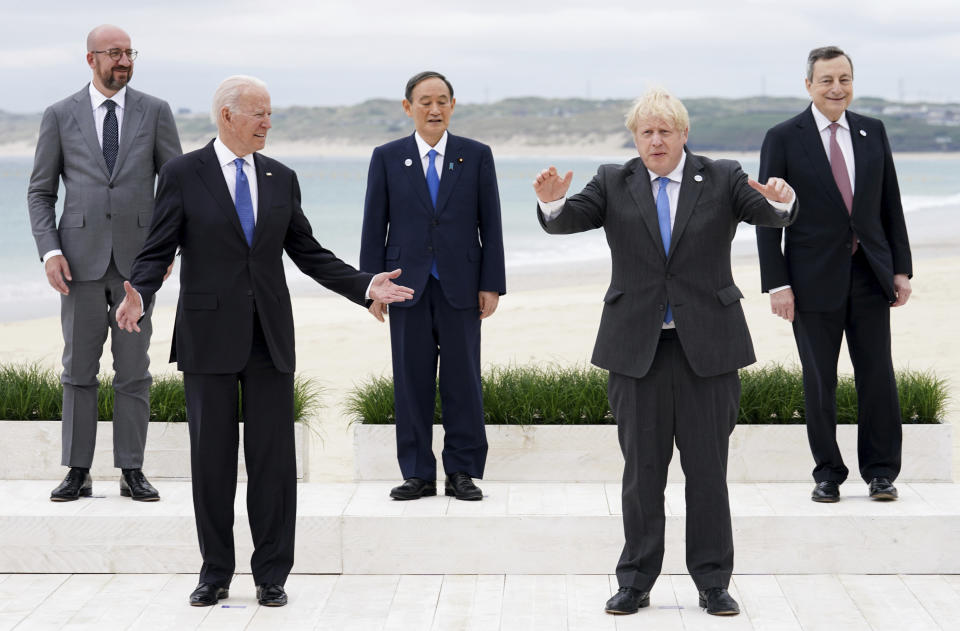 Leaders of the G7 pose during a group photo at the G7 meeting at the Carbis Bay Hotel in Carbis Bay, St. Ives, Cornwall, England, Friday, June 11, 2021. Leaders of the G7 begin their first of three days of meetings on Friday, in which they will discuss COVID-19, climate, foreign policy and the economy. Leaders from left, European Council President Charles Michel, U.S. President Joe Biden, Japan's Prime Minister Yoshihide Suga, British Prime Minister Boris Johnson and Italy's Prime Minister Mario Draghi. (Phil Noble, Pool via AP)