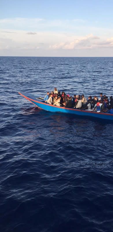 Migrants are seen in a dinghy as they are rescued by Libyan coast guards at the Mediterranean Sea off the coast of Libya