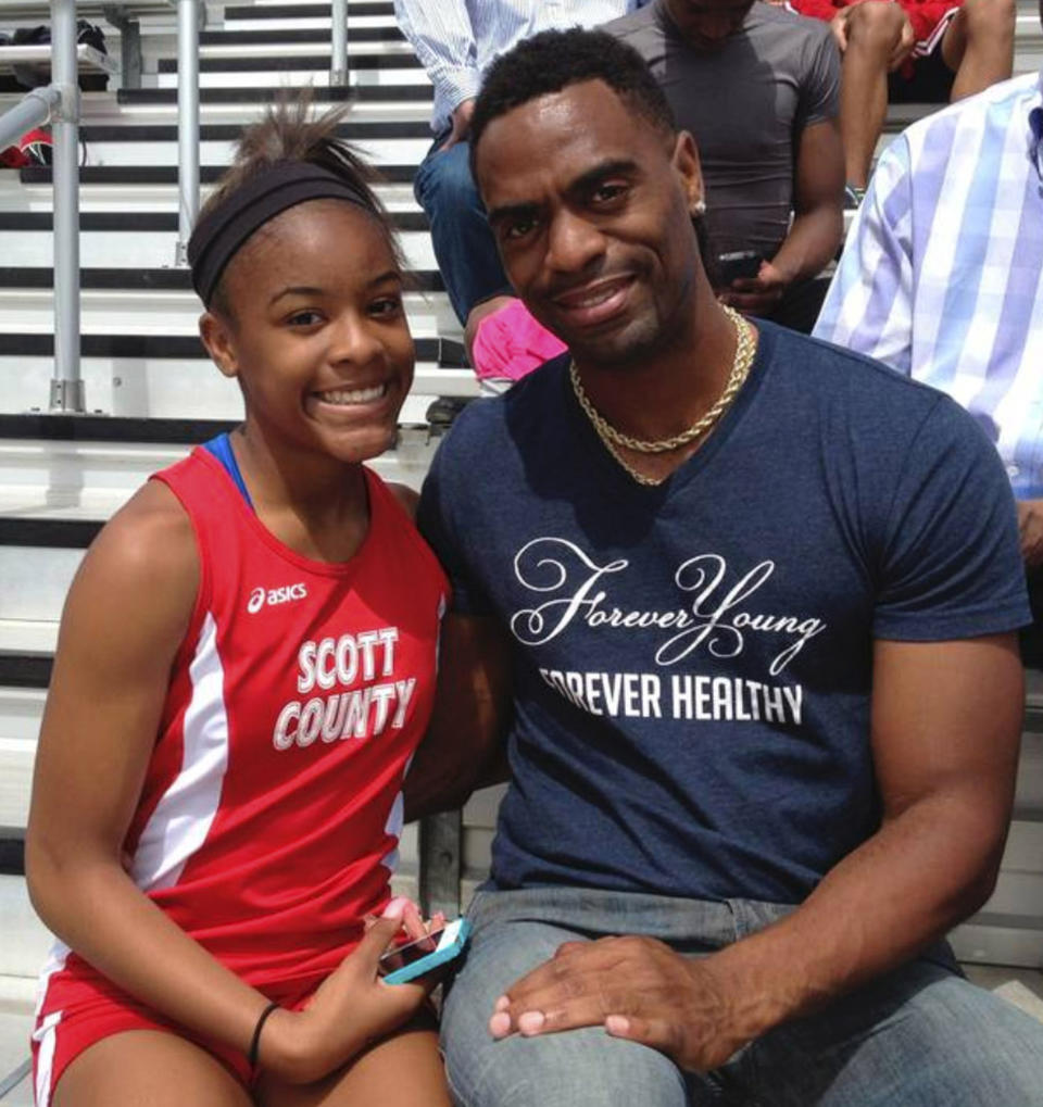 In this 2014 photo, U.S. Olympian Tyson Gay posed with his daughter, Trinity. Trinity Gay was killed outside of a Lexington, Ky. restaurant on Oct. 16, 2016; on Monday, four men were found guilty in connection with her death. (AP)