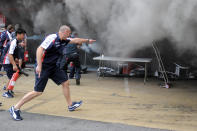 Racing team crews use a fire hose to try and extinguish a fire in the Williams racing pit stand at the Circuit de Catalunya on May , 2012 in Montmelo on the outskirts of Barcelona after the Spanish Formula One Grand Prix. AFP PHOTO / JOSEP LAGOJOSEP LAGO/AFP/GettyImages