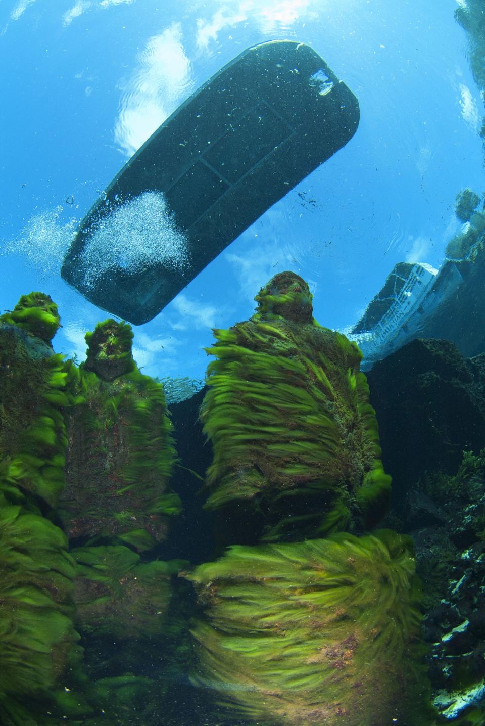 A glass-bottom boat visits the “I Spy” statues in the main spring at the Silver Springs nature park on July 25, 2012. Silver Springs comprises a group of artesian springs and a historic tourist attraction that is now part of Silver Springs State Park.