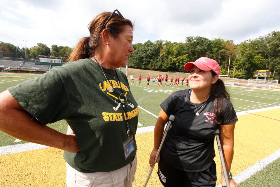 Lakeland High School field hockey coach Sharon Sarsen, left, talks to Sara Witmer, her former player and present coach of the Conard High School team of Connecticut before a scrimmage between the two teams at Lakeland High School in Shrub Oak Aug. 29, 2022. Witmer, who played for Lakeland High School, graduated in 2001.