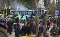Farmers and tractors gather outside of an EU summit in Brussels, Thursday, Feb. 20, 2020. Baltic farmers on Thursday were calling for a fair allocation of direct payments under the European Union's Common Agricultural Policy. (AP Photo/Olivier Matthys)