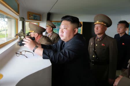 North Korean leader Kim Jong Un inspects the defence detachment on Jangjae Islet and the Hero Defence Detachment on Mu Islet located in the southernmost part of the waters off the southwest front, in this undated photo released by North Korea's Korean Central News Agency (KCNA) on May 5, 2017. KCNA/ via REUTERS