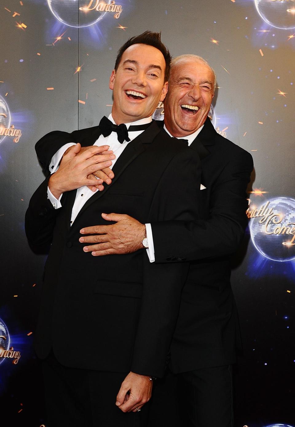 Craig Revel Horwood pictured with Len Goodman (PA)