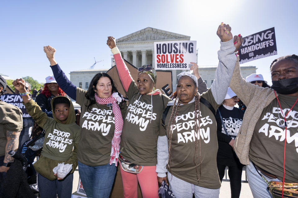 Activists demonstrate at the Supreme Court as the justices consider a challenge to rulings that found punishing people for sleeping outside when shelter space is lacking amounts to unconstitutional cruel and unusual punishment, on Capitol Hill in Washington, Monday, April 22, 2024. (AP Photo/J. Scott Applewhite)