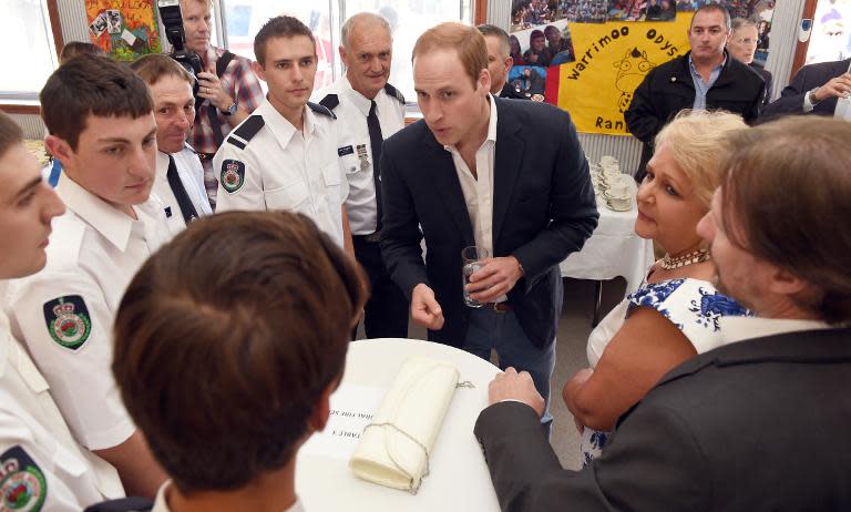 Prince William meets with emergency services personnel at Winmalee, an area in the Blue Mountains heavily affected by bushfires, on April 17, 2014