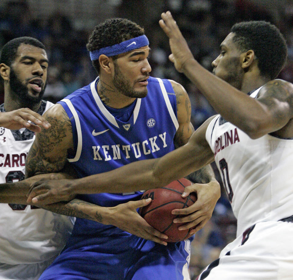 Kentucky's Willie Cauley-Stein (15) battles for the rebound with South Carolina's Sindarous Thornwell (0),and Desmond Ringer during the first half of an NCAA college basketball game Saturday March 1, 2014 in Columbia, S.C. (AP Photo/Mary Ann Chastain)