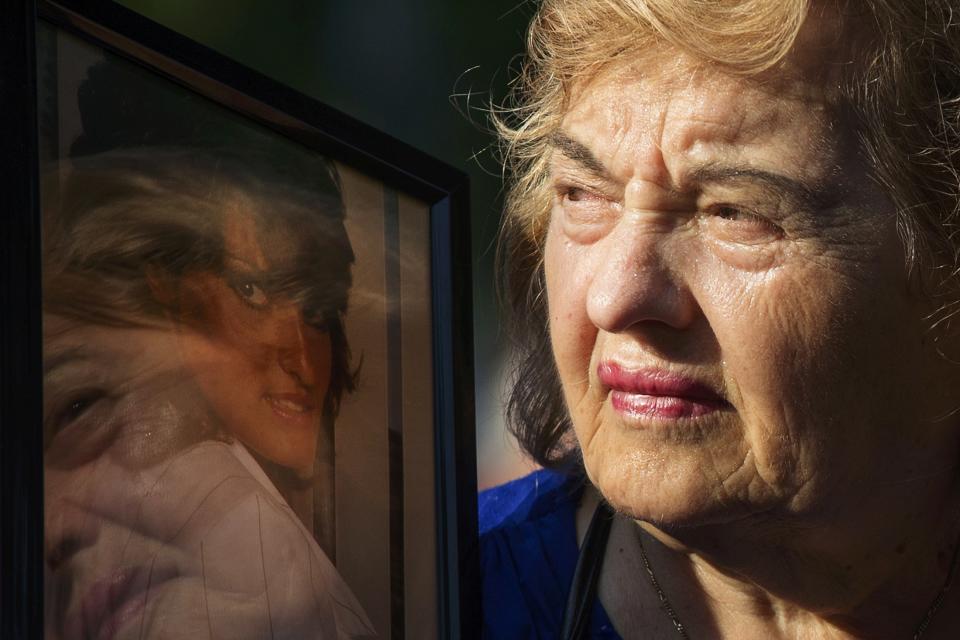 Ester DiNardo, mother of Marisa DiNardo, clutches her image while attending the 9/11 Memorial ceremonies marking the 12th anniversary of the 9/11 attacks on the World Trade Center in New York on September 11, 2013. (REUTERS/Adrees Latif)