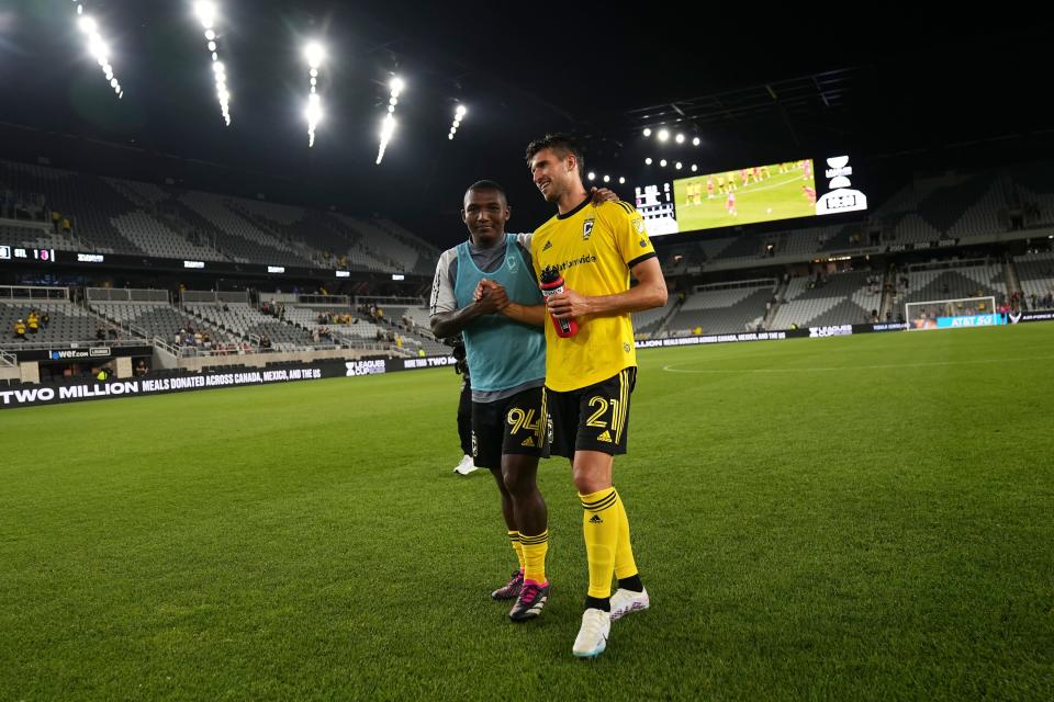 Jul 23, 2023; Columbus, Ohio, USA;  Columbus Crew midfielder Jimmy Medranda (94) hugs defender Yevhen Cheberko (21), who made his team debut, following the Leagues Cup match against the St. Louis City at Lower.com Field. The Crew won 2-1.