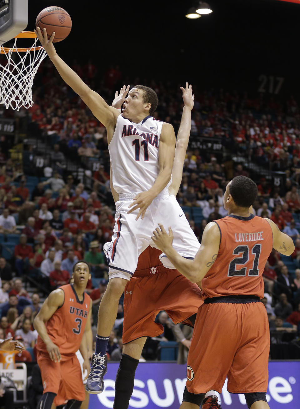 Arizona's Aaron Gordon (11) puts up a shot past Utah's Jordan Loveridge during the first half of an NCAA college basketball game in the quarterfinals of the Pac-12 Conference tournament, Thursday, March 13, 2014, in Las Vegas. (AP Photo/Julie Jacobson)