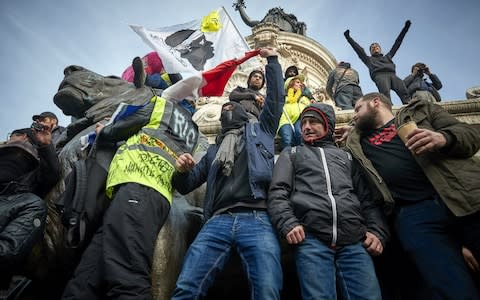 Protestors demonstrate at Place de la Republique chanting against President Macron - Credit: Getty Images