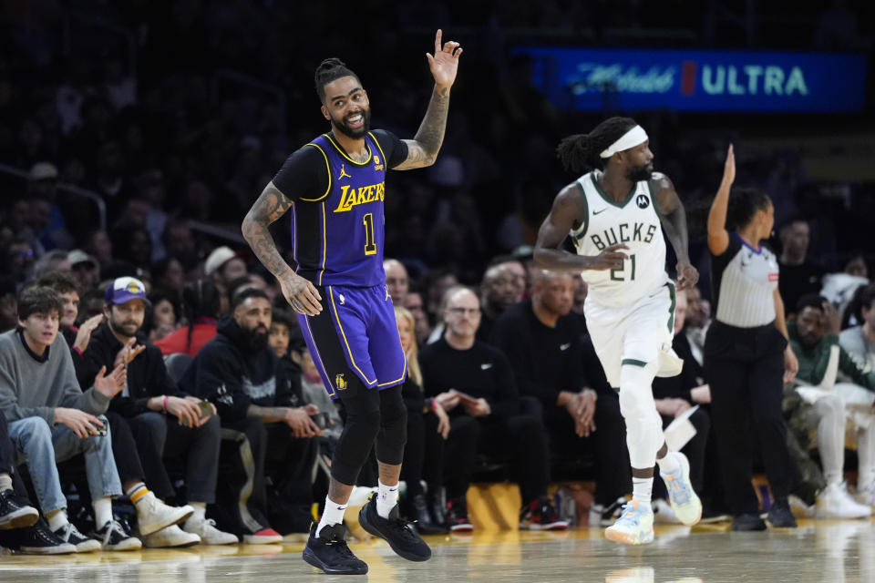 Los Angeles Lakers guard D'Angelo Russell (1) celebrates his basket against the Milwaukee Bucks during the second half of an NBA basketball game Friday, March 8, 2024, in Los Angeles. The Lakers won 123-122. (AP Photo/Jae C. Hong)