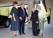 <p>Melania went for a loose navy dress to meet the Japanese Emperor and his wife in Tokyo, finishing off her prim and proper look with a pair of metallic stilettos.<br><i>[Photo: Getty]</i> </p>