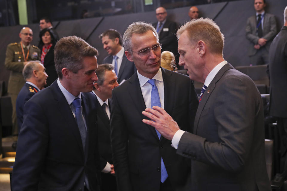 Acting US Defense Secretary Patrick Shanahan, right, talks to NATO's Secretary General Jens Stoltenberg, centre, and Britain's Defense Minister Gavin Williamson during the second day of a NATO defense ministers meeting at NATO headquarters in Brussels, Thursday, Feb. 14, 2019. NATO defense ministers are discussing the future of the alliance's operation in Afghanistan and how best to use its military presence to support political talks aimed at ending the conflict. (AP Photo/Francisco Seco)