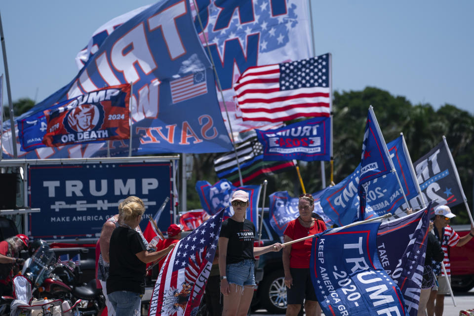 Supporters of former President Donald Trump gather outside Mar-A-Lago, Sunday, June 11, 2023, in Palm Beach, Fla. (AP Photo/Evan Vucci)