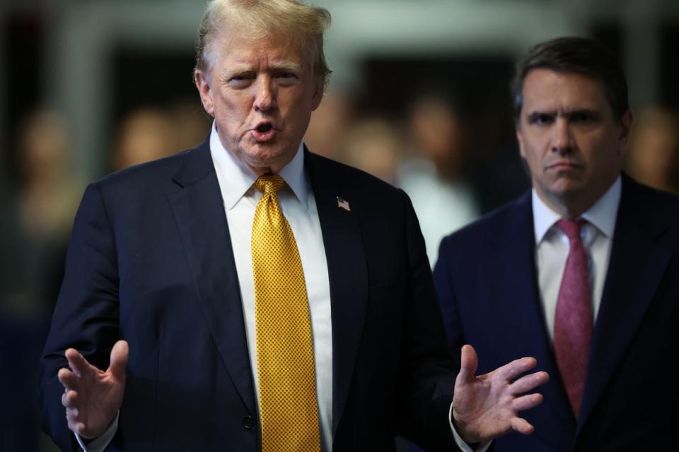 Donald Trump walks toward the press to speak after the 12 jurors in his criminal trial began deliberating at Manhattan Criminal Court on 29 May (EPA)